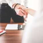 Business Man And Woman Handshake In Work Office Picjumbo Com