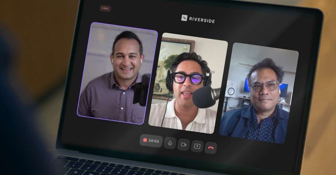 Tony Ringor presents an AI-generated design on a tablet, with Pankaj Raval and Sahil Chaudry reviewing legal documents at a desk, cityscape in the background.
