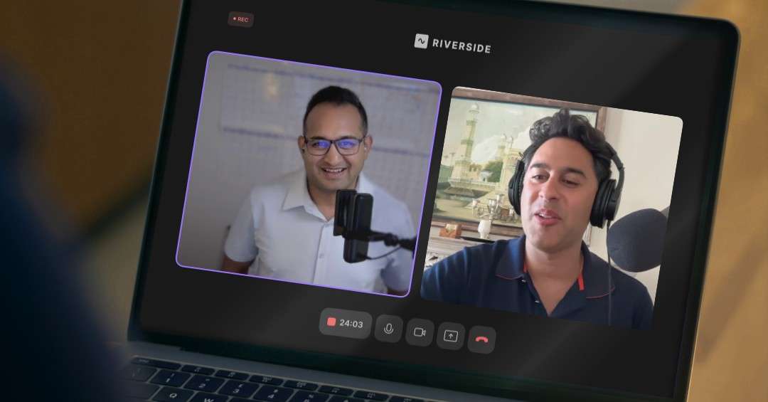 Two professionals recording a podcast remotely on Riverside, smiling and speaking into microphones.