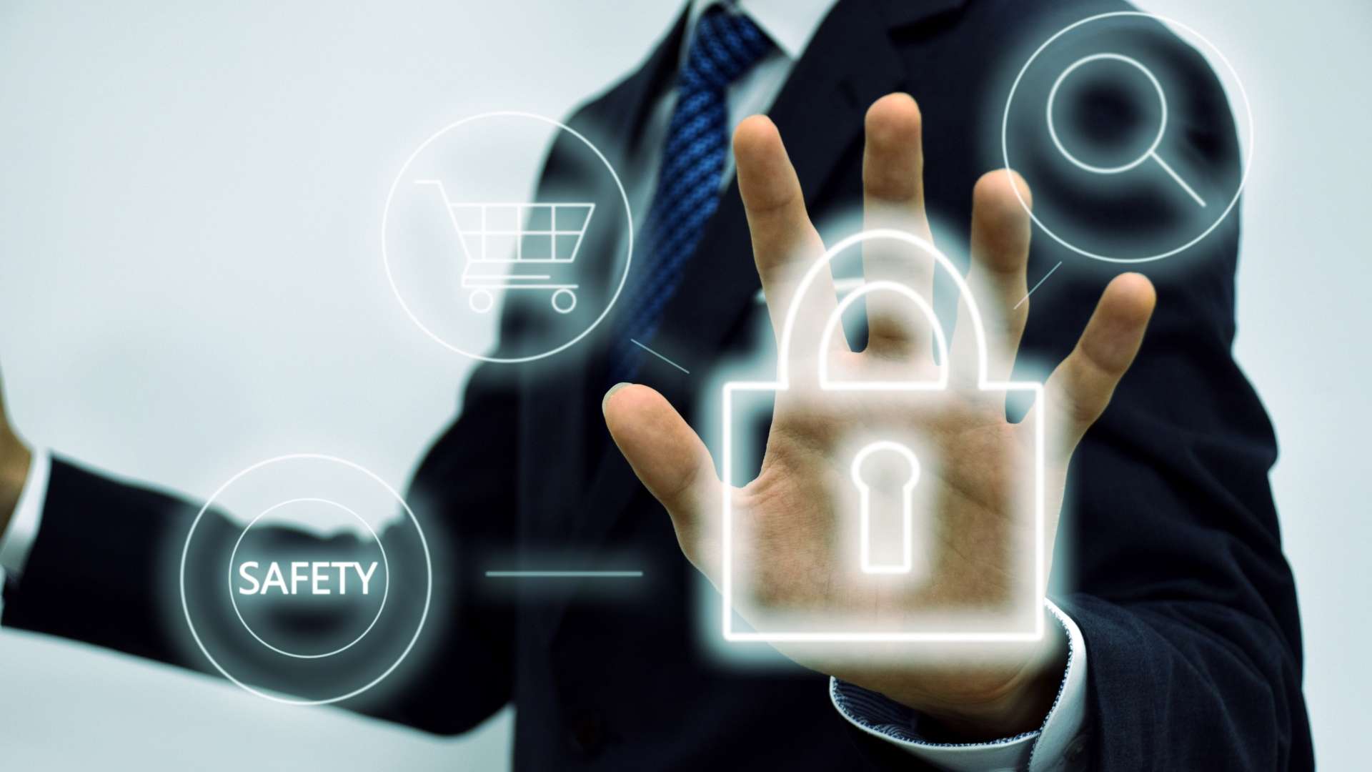 A business professional in a suit touches a digital security interface displaying icons of a padlock, magnifying glass, and safety symbol, representing brand and online protection.