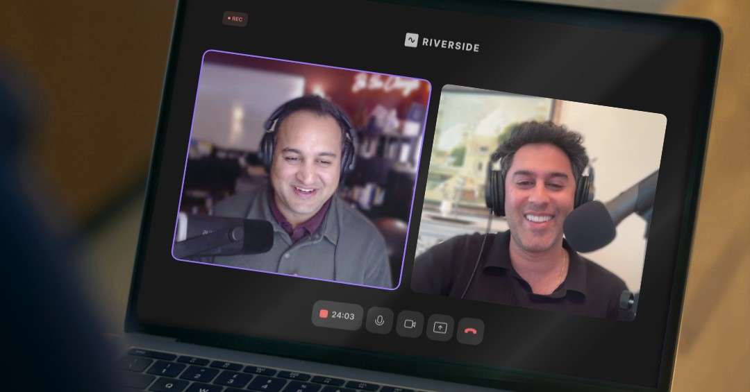 Two people wearing headsets and speaking into microphones during a virtual podcast recording displayed on a laptop screen.