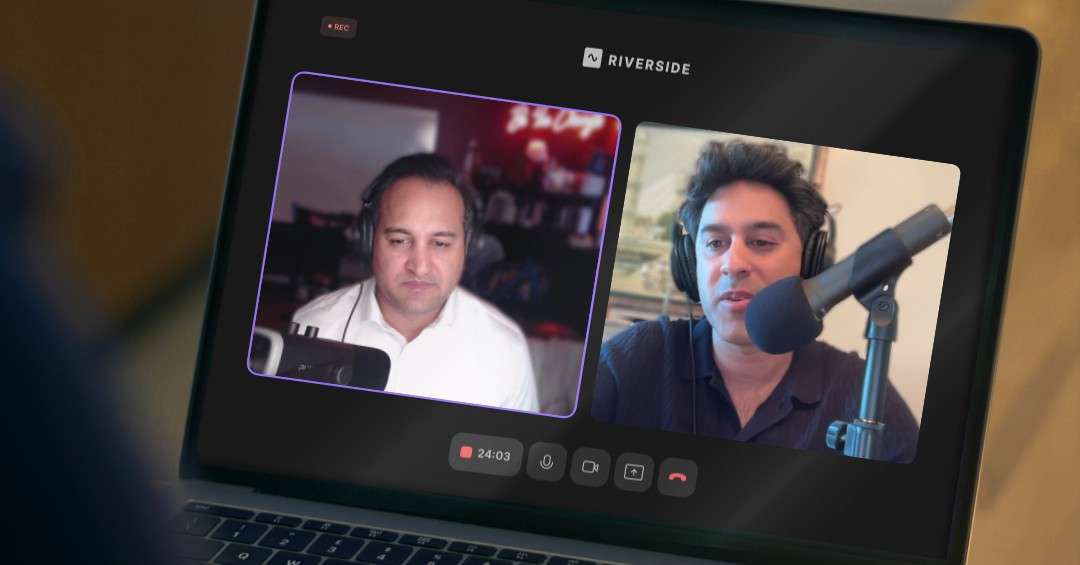 Two people wearing headphones speaking into microphones during a remote podcast recording displayed on a laptop screen