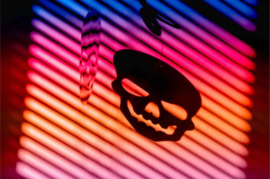 A professional calculating business finances next to a plant growing from a stack of coins, symbolizing financial growth and the temptation to cut costs on legal fees.