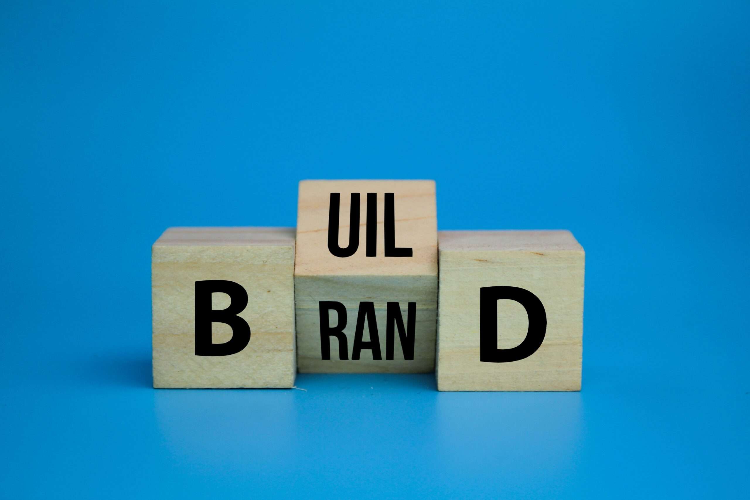 Wooden blocks spelling BUILD YOUR BRAND representing trademark protection for DTC brands in Los Angeles