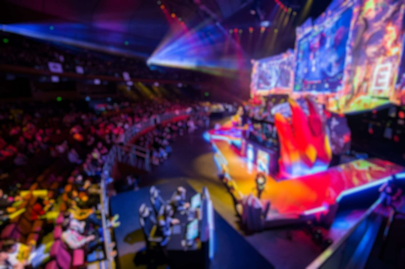 A packed esports arena with colorful stage lighting, large display screens, and players competing on stage, representing the massive live and online audience that VALORANT Masters Bangkok 2026 attracted and the growing esports sponsorship opportunity for small businesses.